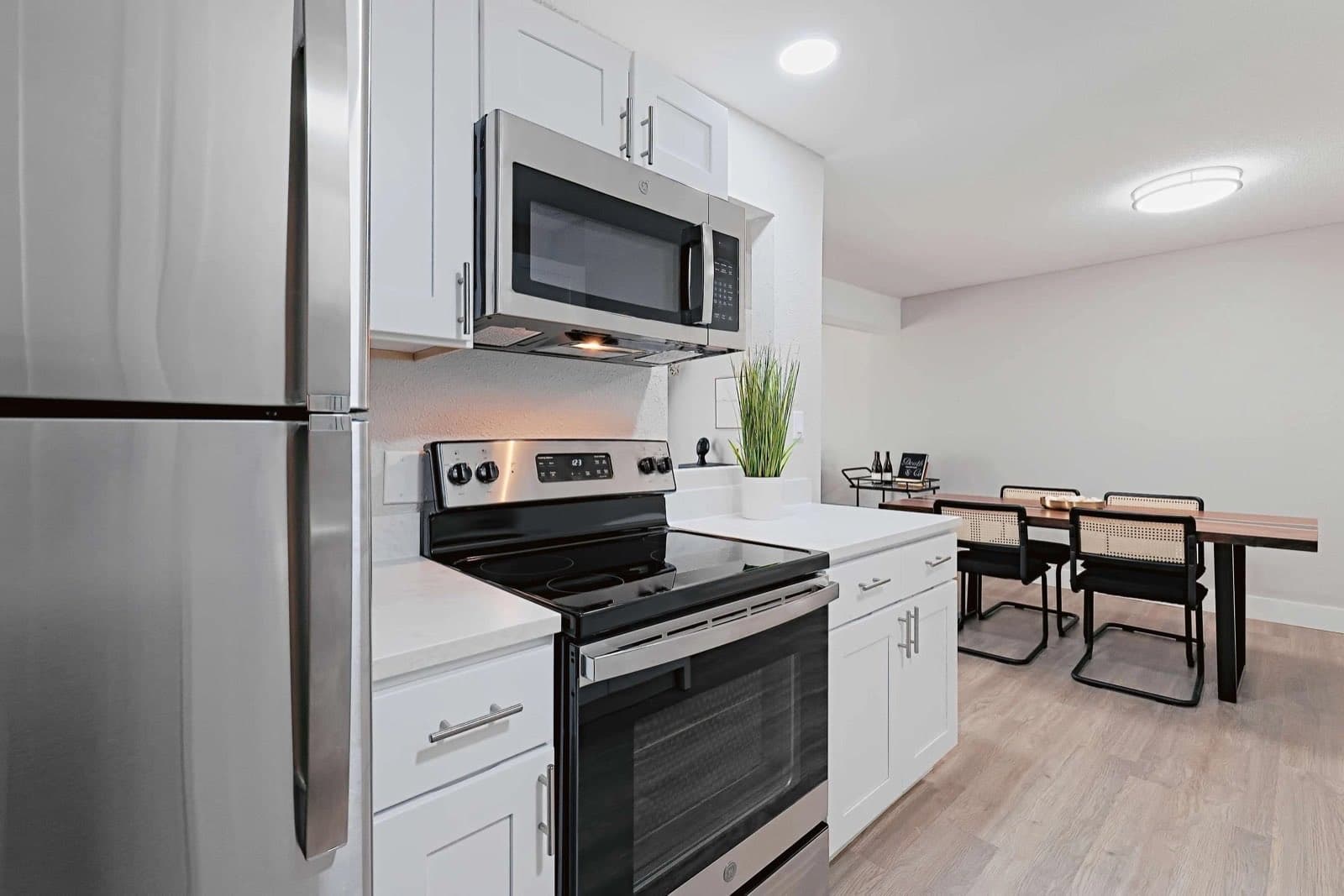 Renovated kitchen with stainless steel appliances at The Grove Apartments in Peoria